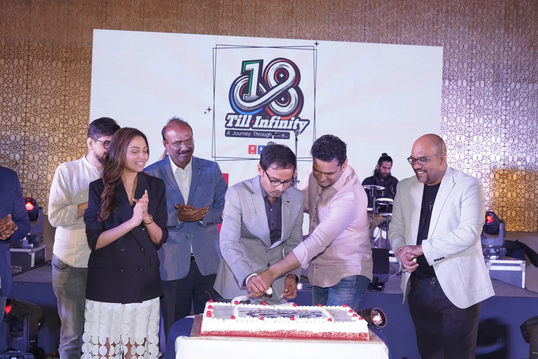 Team celebrating the 18 Till Infinity anniversary